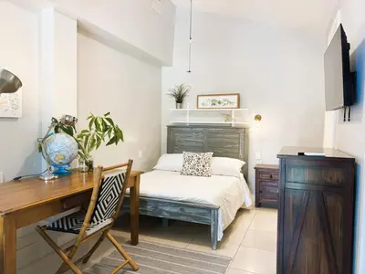 a bedroom with a desk and a bed and a desk and chair at Urban Oasis Studio, Miami near Coral Gables #5 in Miami