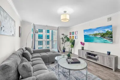a living room with a couch and a table at Lux condo on 25floor in Brickell in Miami