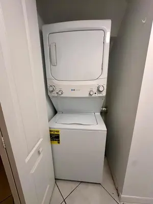 a toilet with a tv on top of it at Beautiful 2brm condo w free parking fast WiFi in Lindgren Acres