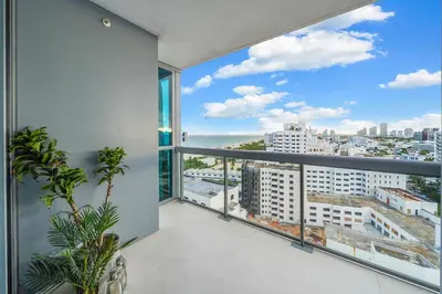 an apartment balcony with a view of the city at Stunning Ocean View Private Residence at The Setai - 2002 in Miami Beach