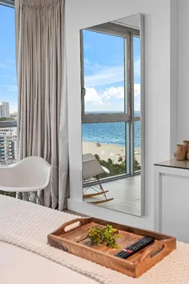 a living room with a view of the ocean at Stunning Ocean View Private Residence at The Setai - 2002 in Miami Beach