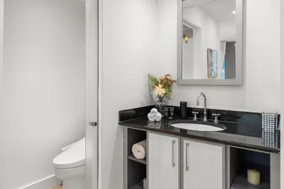 a bathroom with a sink and a toilet at Stunning Ocean View Private Residence at The Setai - 2002 in Miami Beach