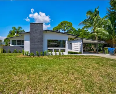 a house with a lawn in front of it at Modern 3BR Home Near Holycross Hospital in Fort Lauderdale