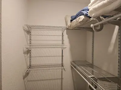 a room with three tiers of shelves in a room at Modern 3BR Home Near Holycross Hospital in Fort Lauderdale