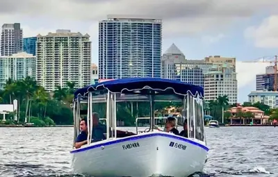 a group of people riding a boat in the water at Modern 3BR Home Near Holycross Hospital in Fort Lauderdale