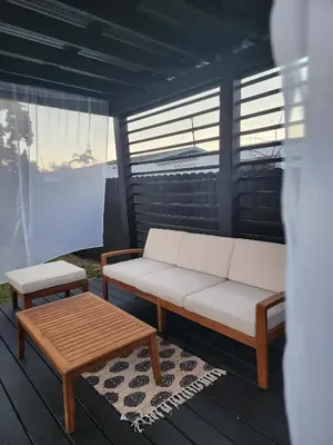 a couch and a coffee table on a porch at Magic City IN THE HEART OF MIAMI in Miami