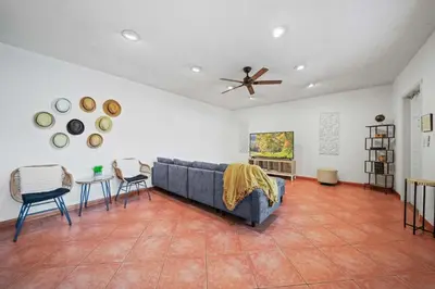 a living room with a couch and a table and chairs at Luxe Escape 2BR Fort Lauderdale in Fort Lauderdale
