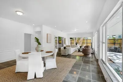 a living room with a white table and chairs at Memory Lane Cozy Home with Pool Lush South Miami in Miami