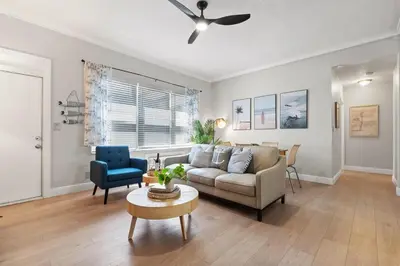 a living room with a couch and a table at Oceanfront Bliss Cozy 1BR by Beach Free Parking in Hollywood