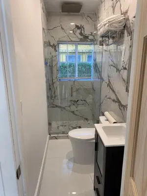 a bathroom with a shower and a toilet and a sink at In the heart of little Havana 5 in Miami