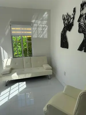 a living room with a couch and a window at In the heart of little Havana 5 in Miami