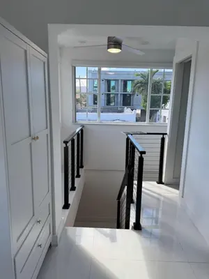 a staircase in a house with a window at In the heart of little Havana 5 in Miami
