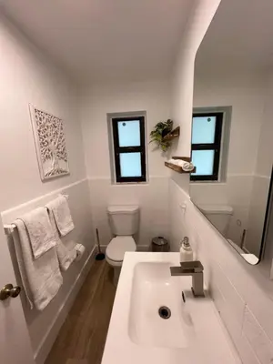 a white bathroom with a sink and a toilet at Near Brickell, Beach & Port 10min, Style & Comfort in Miami