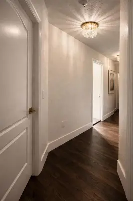 an empty hallway with a door and wood floors at Villa Miami Lakes 2 in Hialeah