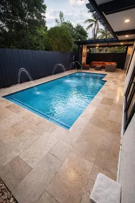 a swimming pool in a yard with a patio at Villa Miami Lakes 2 in Hialeah