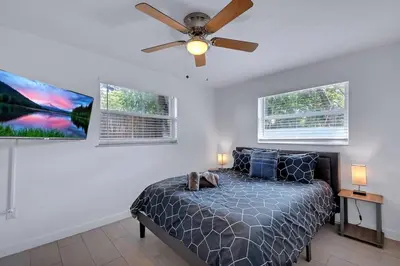 a bedroom with a bed and a ceiling fan at Modern 2BR Near Wynwood and Design District in Miami