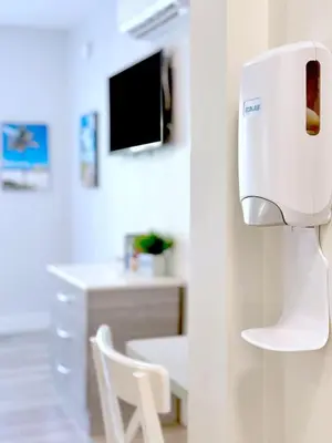 a room with a white hair dryer on the wall at Sunny Beach Studio Steps to Ocean and Nightlife in Miami Beach