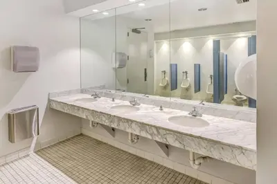 a bathroom with three sinks and a large mirror at Newly Renovated Brickell Stay with Views and Amenities in Miami