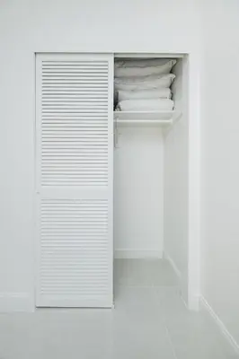 a white closet with white towels in it at Hollywood Beachfront 2-Bedroom Condo with Ocean Views in Hollywood