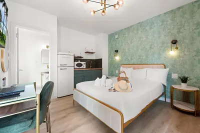 a bedroom with a bed with a hat on it at The Bianco in Miami