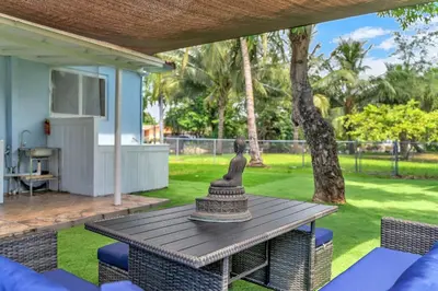 a statue sitting on top of a table on a patio at Costerra Miami 2BR in Miami