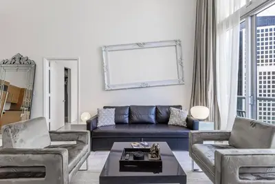 a living room with a couch and a table at Beautiful Icon Brickell Double height ceiling in Miami