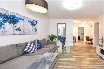 a living room with a couch and a map on the wall at North Beach-Room with Private Entrance in Miami Beach