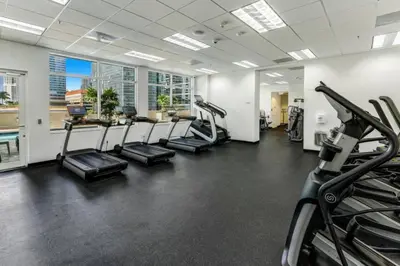 a gym with treadmills and elliptical machines at Brickell Bay Condo with Views plus Parking Sleeps 6 in Miami