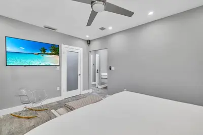 a bedroom with a bed and a ceiling fan at Miami Sombra - Prime Location-Parkfront- Den-Gazebo in Miami