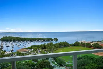 a view of the harbor from the balcony of a condo at Modern Comfort Steps from the Ocean Breeze in Miami