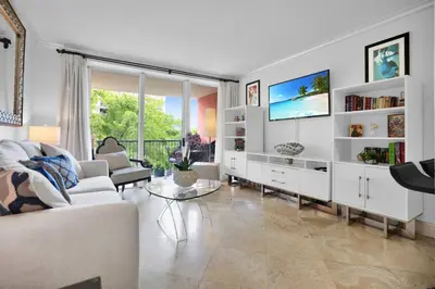 a living room with a white couch and a tv at Bayshore Charm-Free Parking in Miami