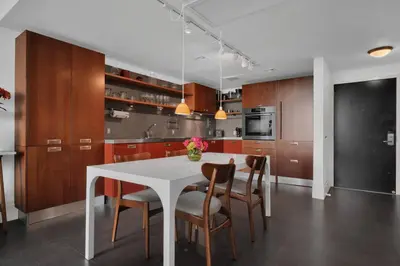 a kitchen with a white table and chairs at Coastal Elegance and Luxury by the Water in Miami