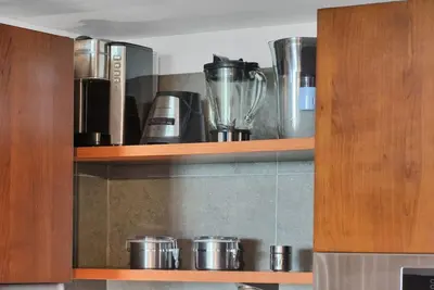a cupboard with a bunch of appliances on it at Coastal Elegance and Luxury by the Water in Miami