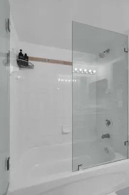a shower with a glass door in a bathroom at Stunning 2B2B Ocean and City Views with Free Parking in Miami