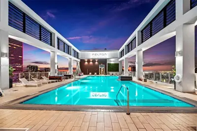 a swimming pool in the middle of a building at Miami HighFlr Corner 1bdr RftopPool FreeParking in Miami