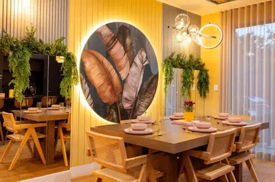 a dining room with a table and chairs and a painting on the wall at 3BR Vibrant Havana Villa in Miami, Pool, Grill, Backyard in Miami