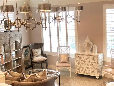 a living room with chairs and a chandelier at Henrosa Hotel in Miami Beach
