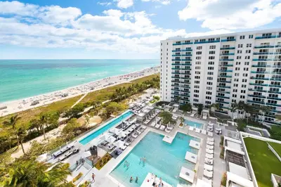 an aerial view of a hotel and the beach at Lumina Residences 2BR Skyline Escape in Miami Beach