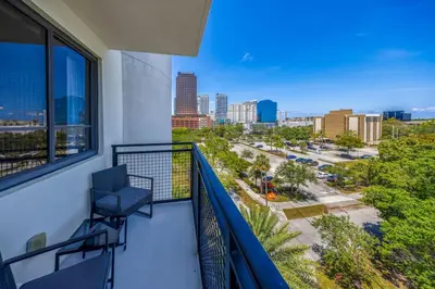 a balcony with a view of a city at Casa Palmera in DTWN 3 Min From Las Olas in Fort Lauderdale