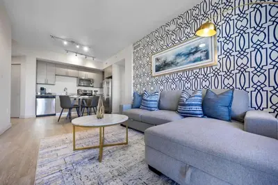 a living room with a couch and a table at Prestige Living in DTWN 3 Min From Las Olas in Fort Lauderdale