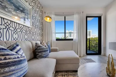 a living room with a couch and a table at Prestige Living in DTWN 3 Min From Las Olas in Fort Lauderdale