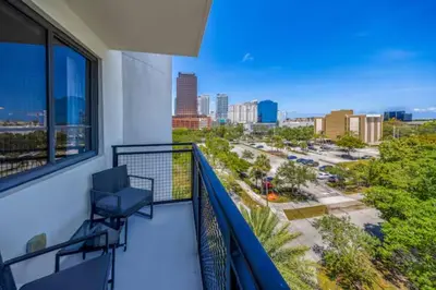 a balcony with a view of a city at Modern Palmera in DTWN 3 Min From Las Olas in Fort Lauderdale