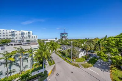 an aerial view of a street with palm trees and buildings at Serene Bleu in DTWN 3 Min From Las Olas in Fort Lauderdale