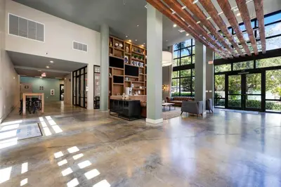 an empty lobby of a house with large windows at The Serenity in DTWN 3 Min From Las Olas in Fort Lauderdale