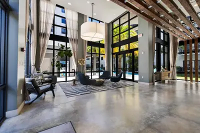 an open living room with a lobby with windows at Palm Paradise in DTWN 3 Min From Las Olas in Fort Lauderdale
