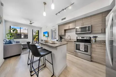 a kitchen with a counter and a stove top oven at Aqua Vista in DTWN 3 Min From Las Olas in Fort Lauderdale