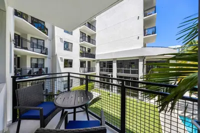 a balcony of a building with a table and chairs at Aqua Vista in DTWN 3 Min From Las Olas in Fort Lauderdale