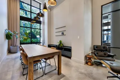 a dining room with a wooden table and chairs at Aqua Vista in DTWN 3 Min From Las Olas in Fort Lauderdale