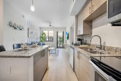 a kitchen with a sink and a counter top at Aqua Vista in DTWN 3 Min From Las Olas in Fort Lauderdale