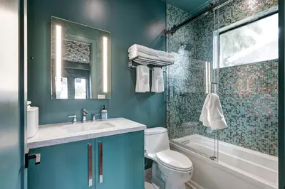 a bathroom with a toilet and a sink and a shower at New Villa Near Hardrock Fll Wboating Near Beach in Fort Lauderdale